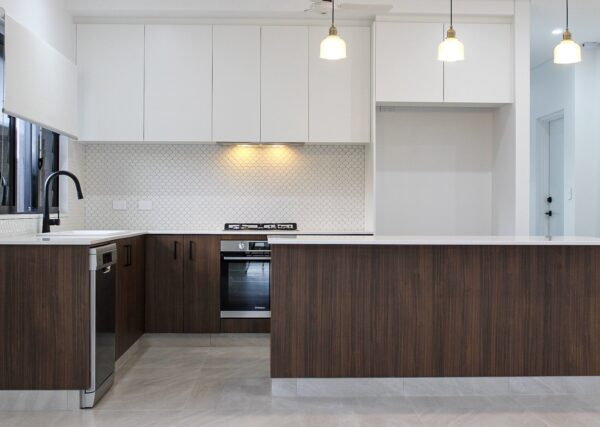 White & Brown Kitchen With Breakfast Bar — Cabinets inspiration in Coconut Grove, NT